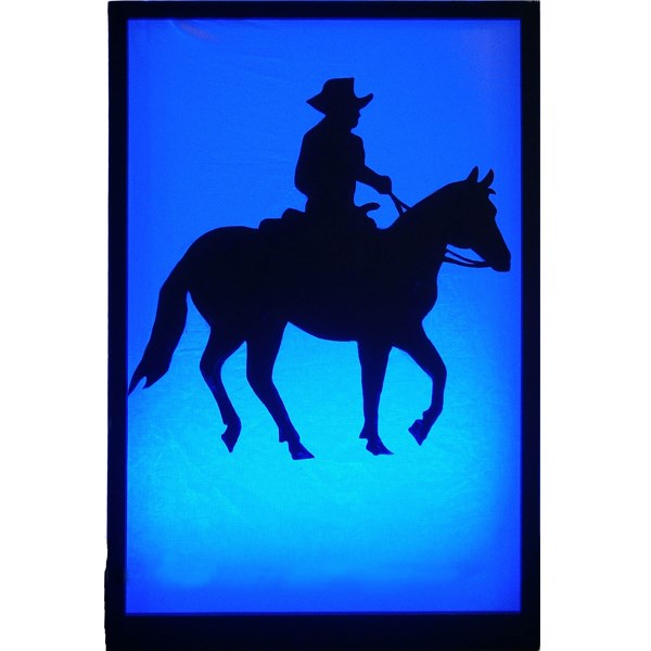 Cowboy on Horseback silhouette shown lit in blue